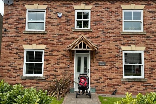 Horncastle family outside new build home with solar panels