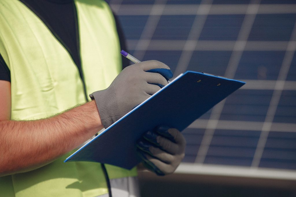 Engineer troubleshooting solar panels