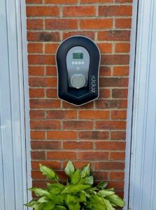 EV charger on detached garage wall