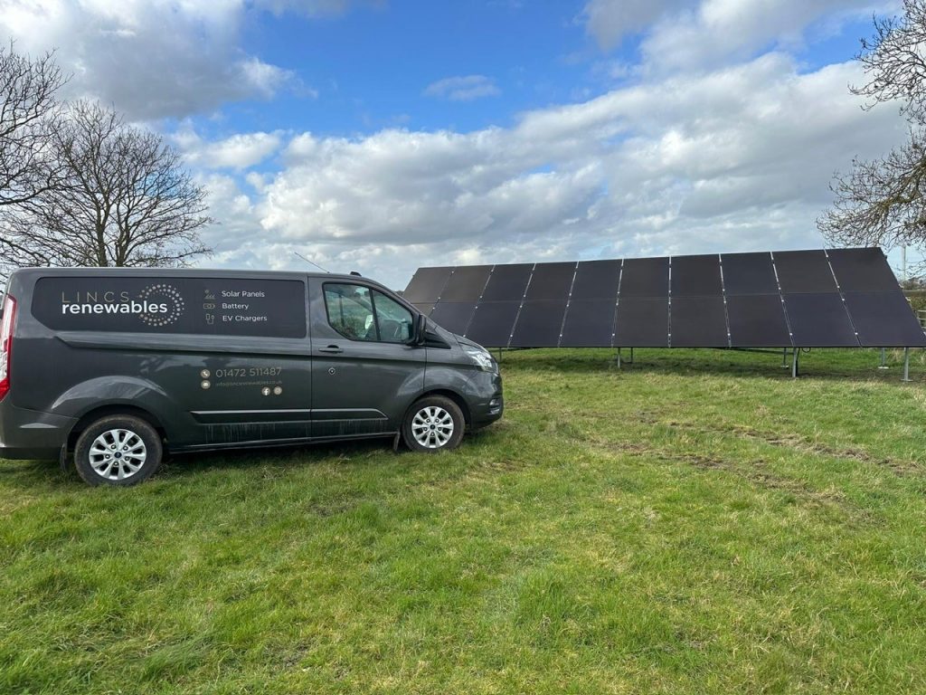 the sign written lincs renewables van in-front of ground mounted solar panels